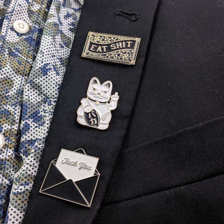 Angled view of Fuck You envelope pin - PABOOM