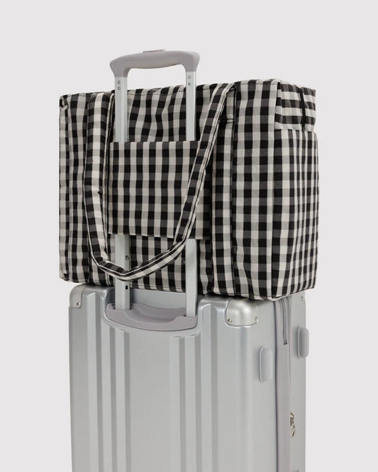 BAGGU Small Cloud Carry-On in black and cream gingham shown flat to highlight its exterior pockets
