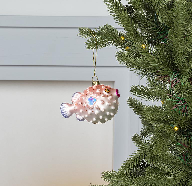 Side view of the glass Puffer Fish Ornament showing its fins and texture.