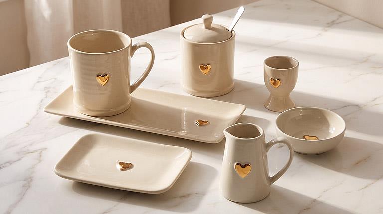 Ivory and gold stoneware heart egg cup, additional angle