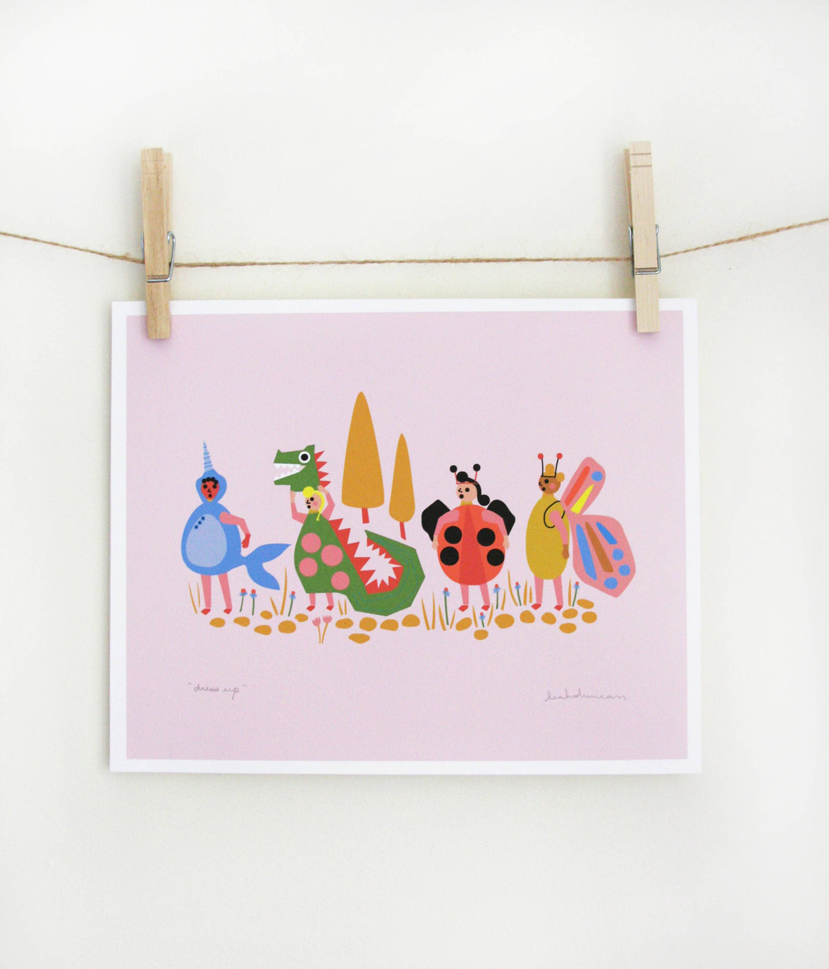 Art print of costumed characters including a mermaid, dragon, ladybug, and butterfly standing in a row on a lavender-pink background, clipped to a string — PABOOM