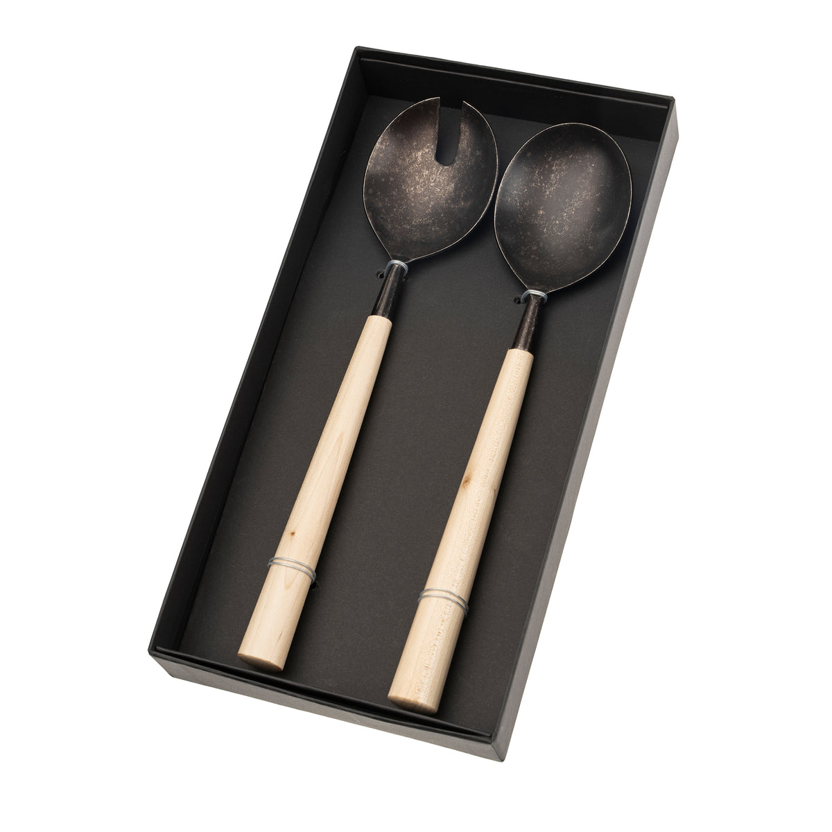 Close-up of a Maple Wood Salad Server with tumbled black finish