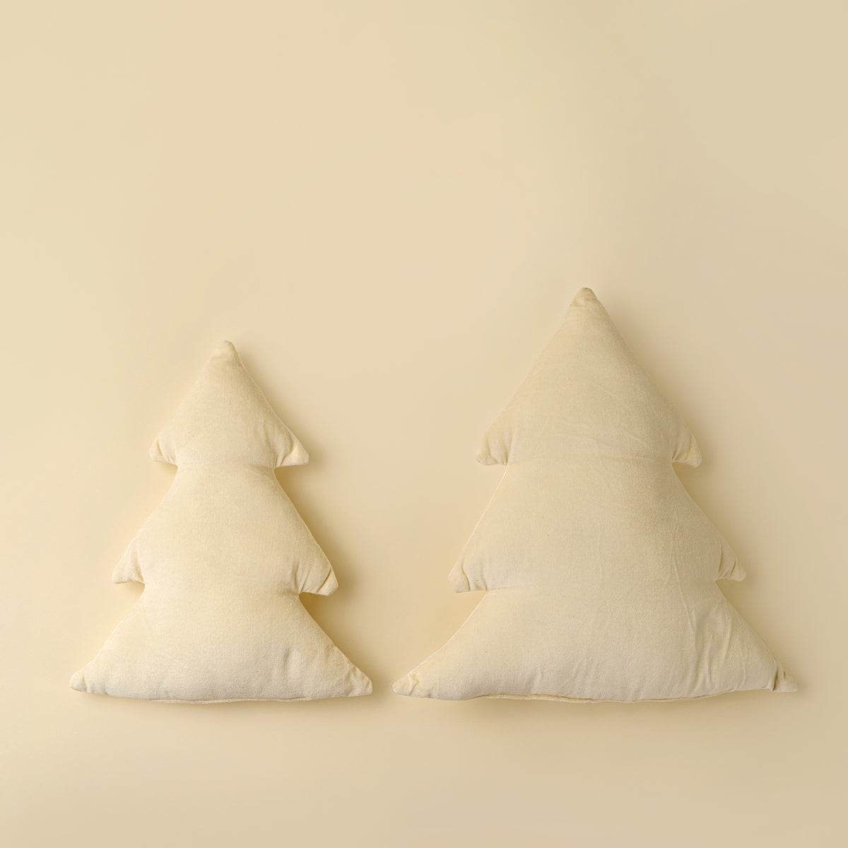 Velvet Tree Pillow in Ivory styled on a sofa