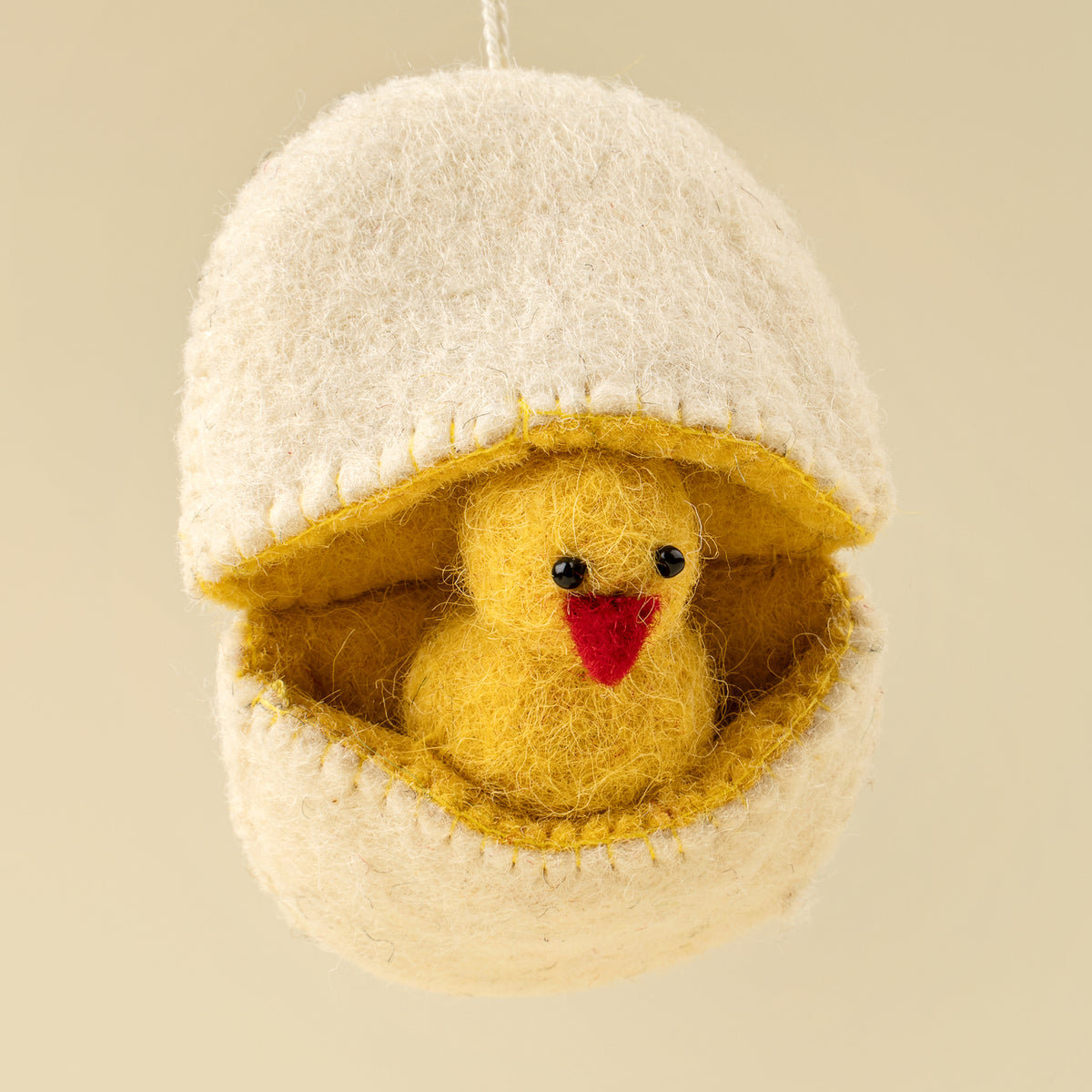 Hatching Chick Felt Ornament hanging by its cord