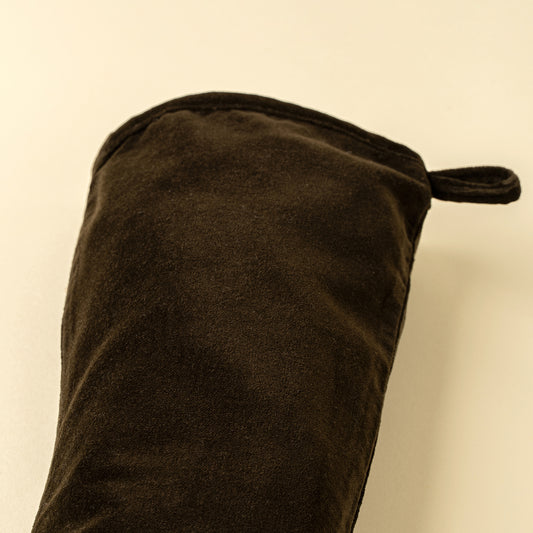 Vera Velvet Stocking in Midnight Green hung on a mantel