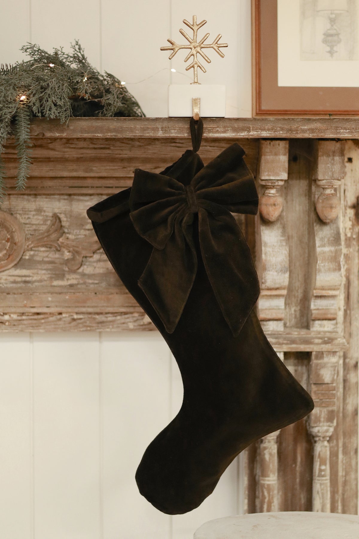 Vera Velvet Stocking in Midnight Green styled with holiday greenery