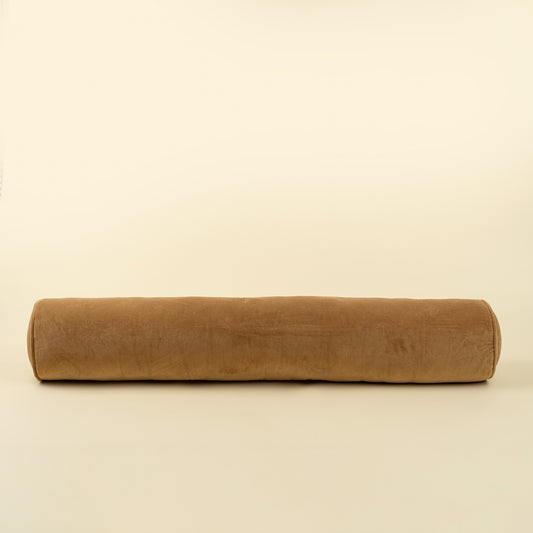 Vera Velvet Long Bolster in Gold shown from an angled view