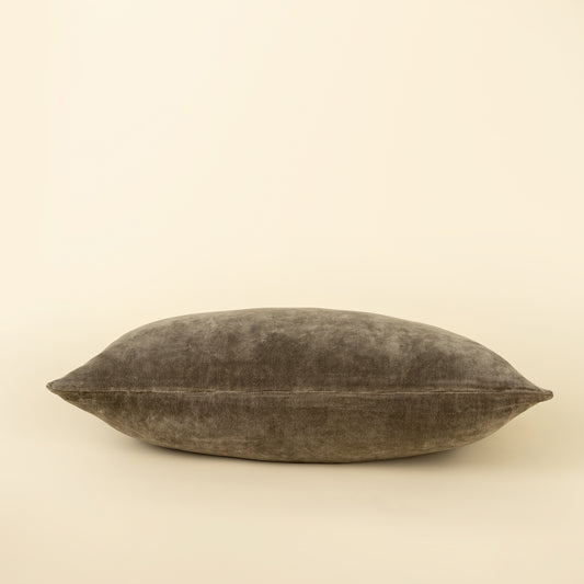 Vera Luxe Velvet Pillow in Cypress styled on a sofa