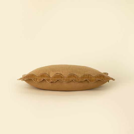 Close-up of the scalloped velvet border on the Velvet Scallop Pillow in Gold