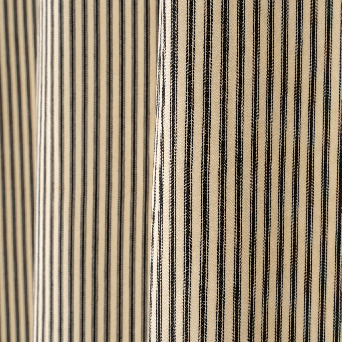Close-up of the ticking stripe fabric on the Black Ticking Shower Curtain
