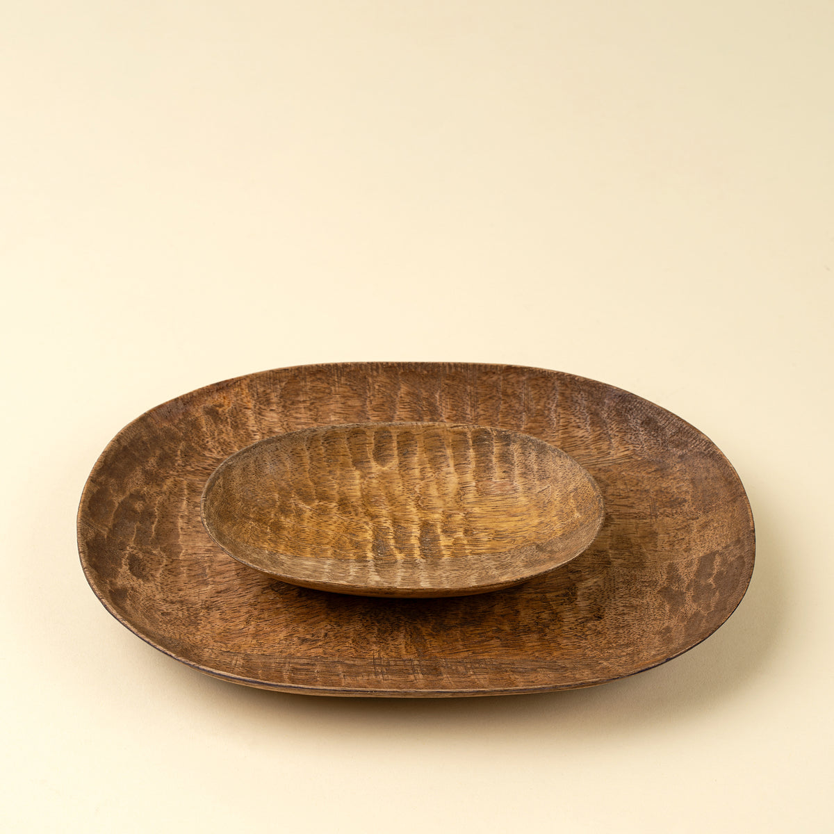 Terrain Carved Dish styled on a table with other tabletop accents