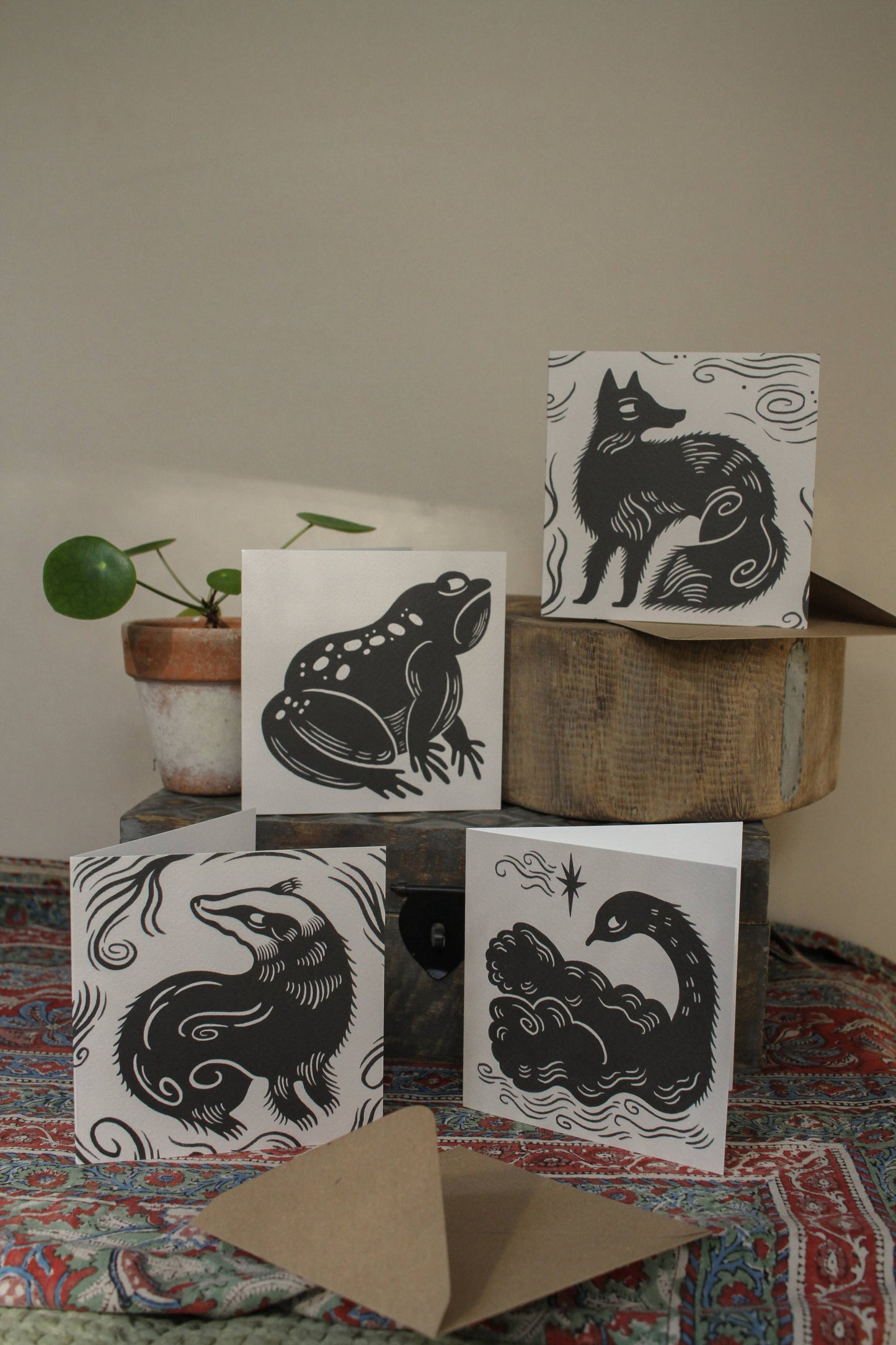 'The Badger' square animal card displayed at an angle with envelope