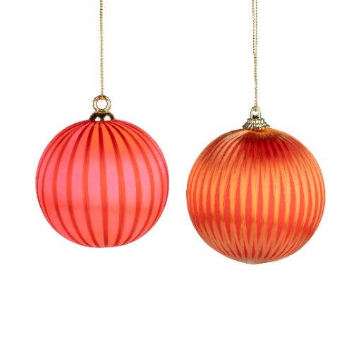 Pinstriped red and orange yarn ball ornaments hanging by gold cord - PABOOM