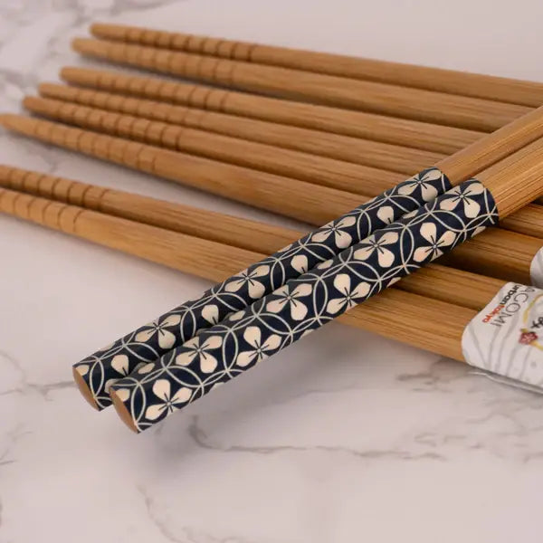 Indigo patterned chopsticks on a table - PABOOM