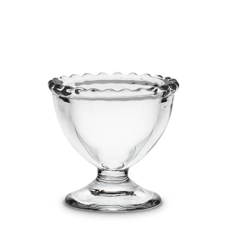 Glass egg cup with pedestal bottom and scalloped dotted rim, clear glass
