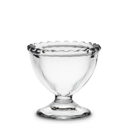 Glass egg cup with pedestal bottom and scalloped dotted rim, clear glass