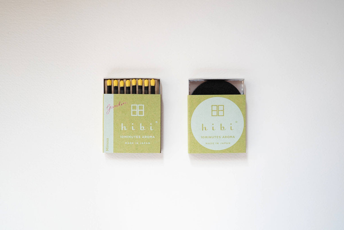 Hibi Mimosa incense matches in a pale yellow-green box, open to show matchsticks beside a closed box - PABOOM