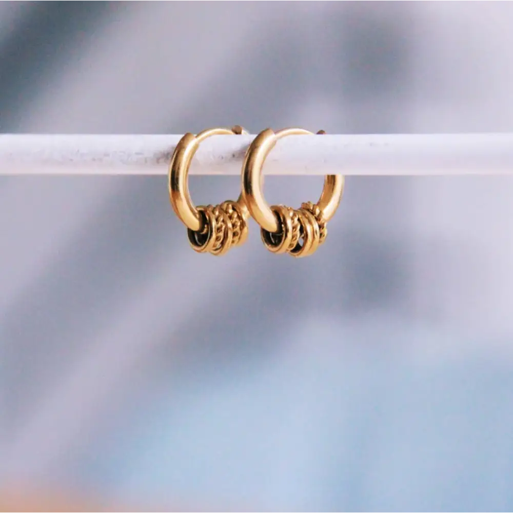 Bazou - Stainless steel hoops with twisted rings - gold