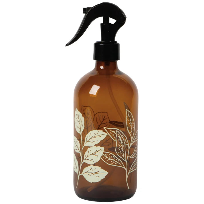 Amber glass spray bottle with a black trigger nozzle, printed with cream fern and leaf illustrations – PABOOM