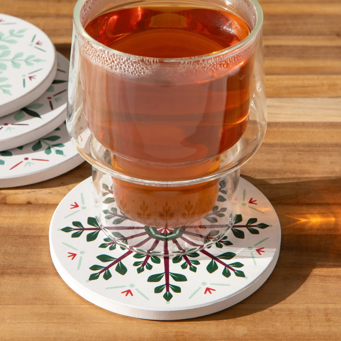 Close-up of a snowflake medallion pattern on a Good Tidings coaster - PABOOM