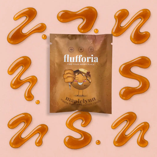 Package of Flufforia’s cotton candy, Maplelynn flavour, brown package. Pink background with maple squirts around - PABOOM