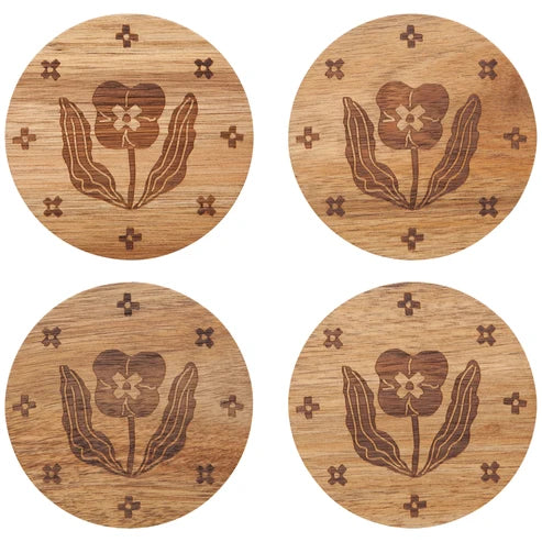 Four round acacia wood coasters laser-engraved with a pansy flower and small cross accents - PABOOM