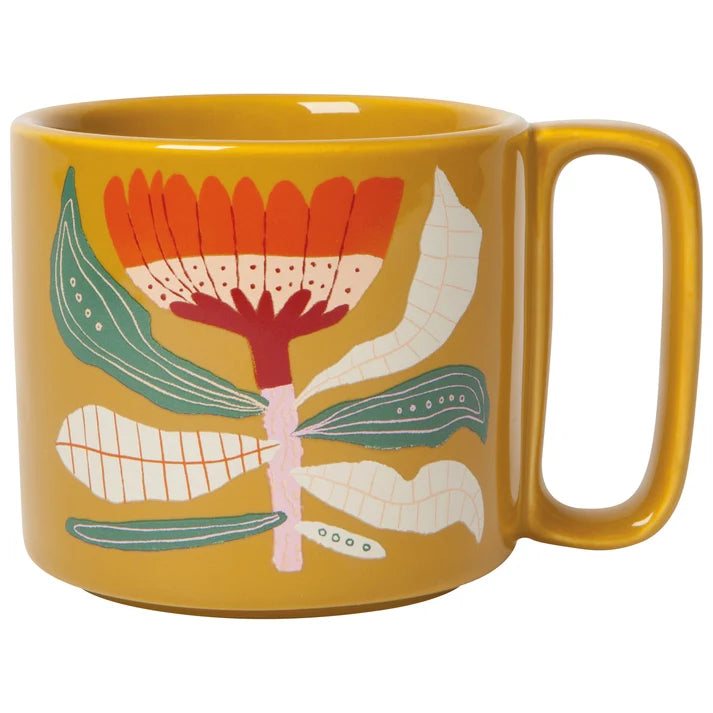 Cream stoneware mug with a bold orange and burgundy botanical flower print, mid-sized with a rounded handle β PABOOM