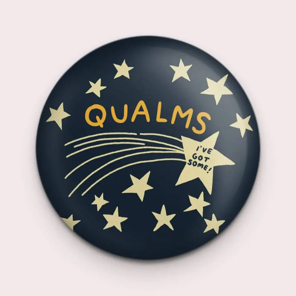 Round magnet with image if a shooting star and yellow text saying QAULMS- I’VE GOT SOME - PABOOM