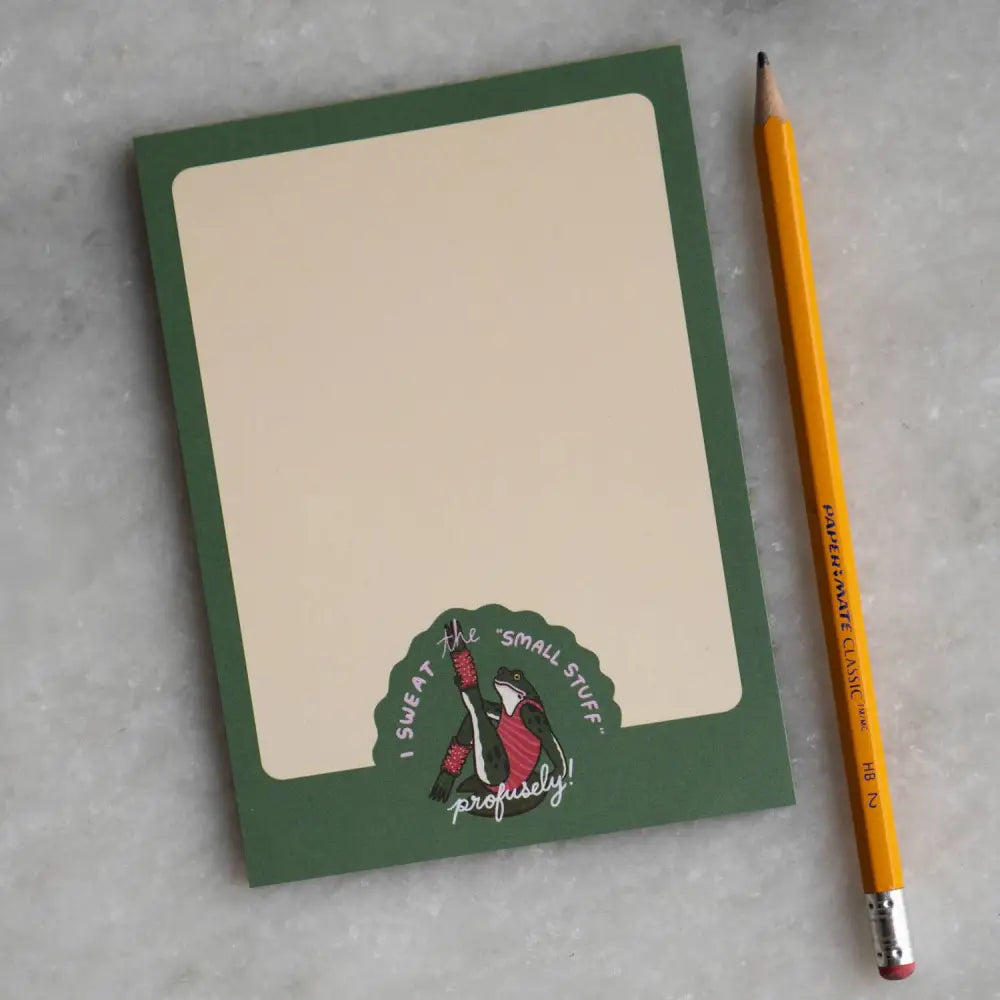 Notepad with a logo of a frog doing aerobics and text βI SWEAT THE SMALL STUFF β¦ profuselyβ by Stay Home Club - PABOOM