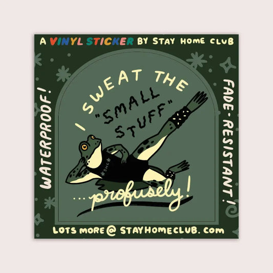 Green vinyl sticker of a frog doing aerobics and text “I SWEAT THE SMALL STUFF … profusely” by Stay Home Club on backing - PABOOM