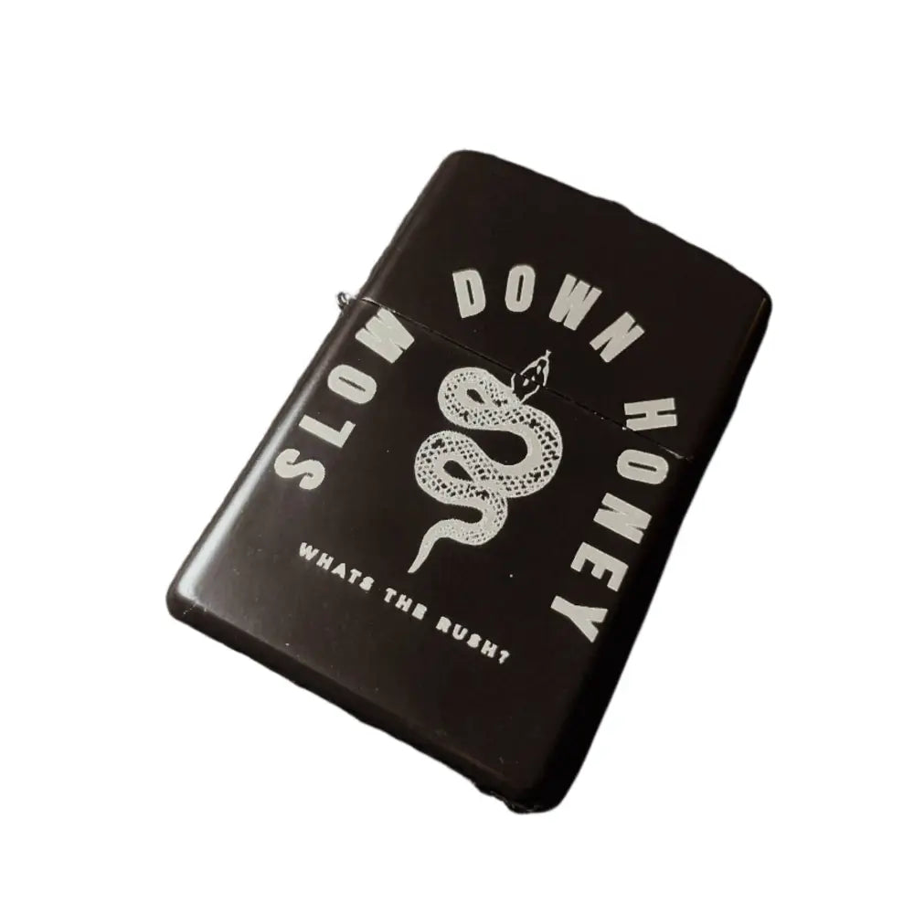Zippo black lighter with a snake and text SLOW DOWN HONEY whats the rush?