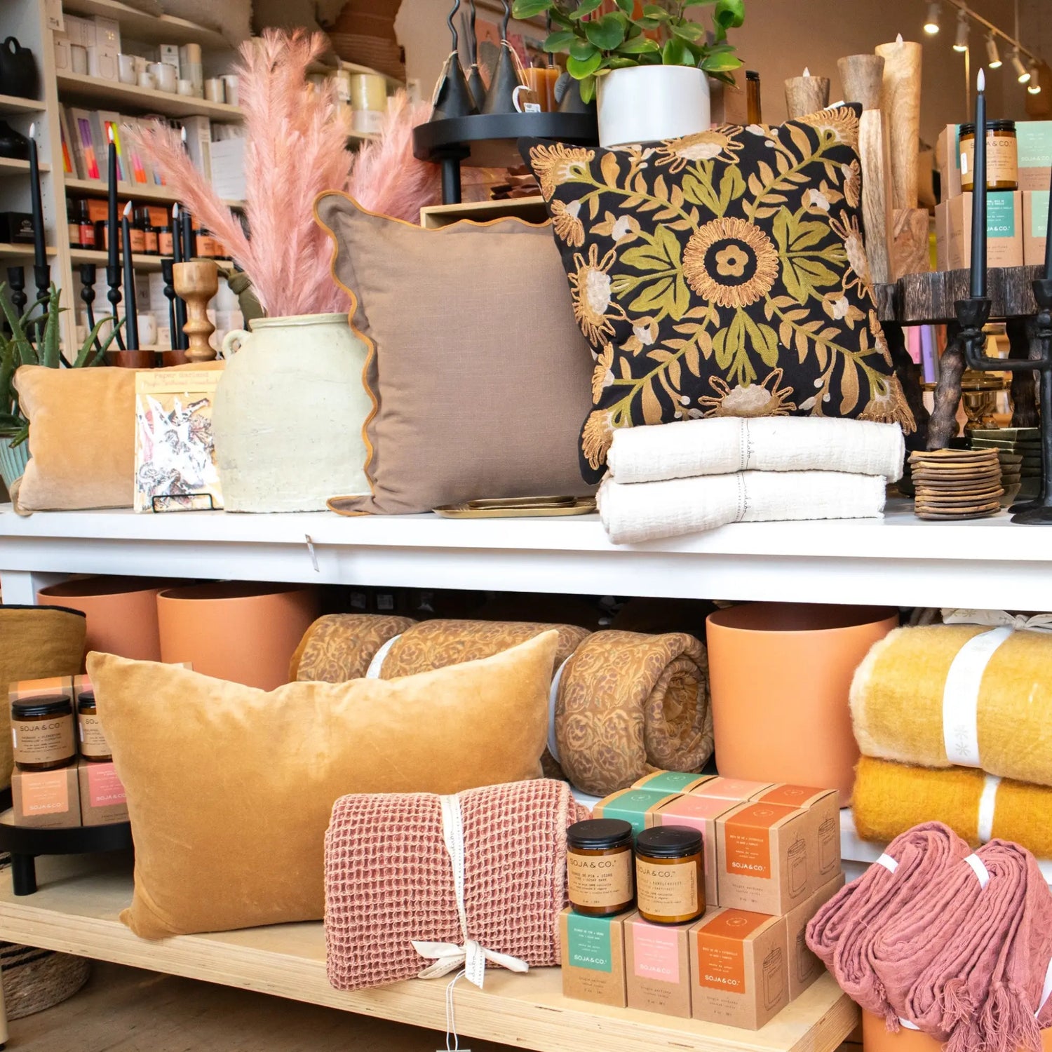 A pile of linen cushion on a chair - PABOOM