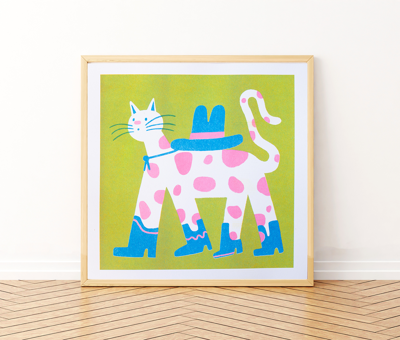 Cowboy Cat Square Risograph Art Print — illustration of a pink-spotted cat wearing a blue cowboy hat and boots, shown framed