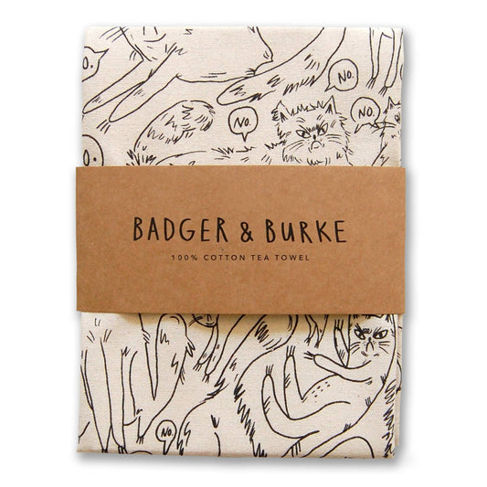 Folded natural cotton tea towel printed with fluffy grumpy cats saying No in speech bubbles, Badger + Burke kraft band - PABOOM