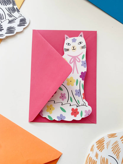 Sitting Kitty Shaped Greeting Card - Black White displayed in a styled flat lay
