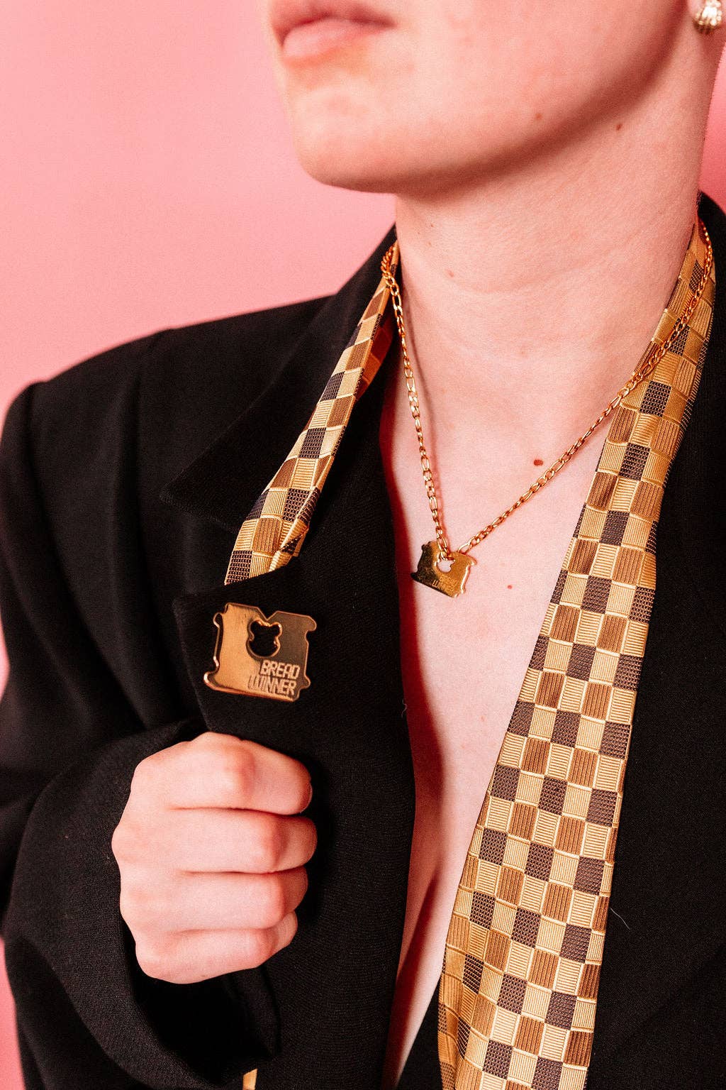Bread Winner pin pinned onto fabric