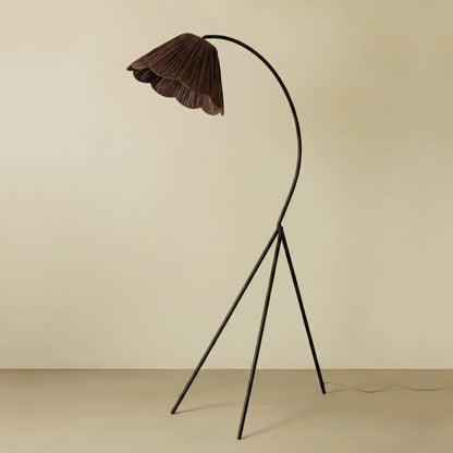 Swedish floor lamp with a scalloped brown raffia shade on an arched black tripod stand - PABOOM