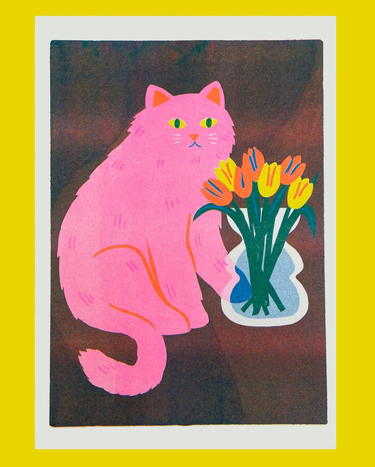 Risograph print of a pink cat sniffing a vase of orange and yellow tulips on a dark background - PABOOM