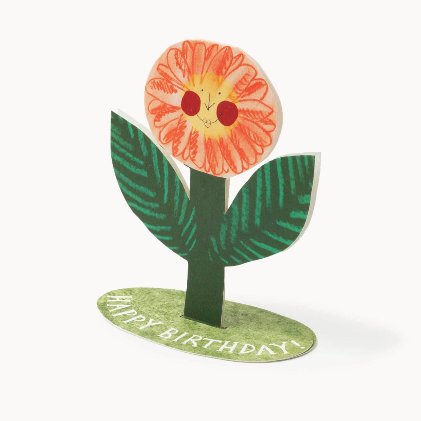 Free-standing hand-drawn orange flower with a smiling rosy-cheeked face, on a green grassy base reading 'Happy Birthday!'