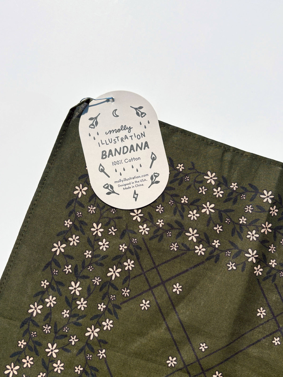 The Scrolling Floral bandana shown fully unfolded to display the full print