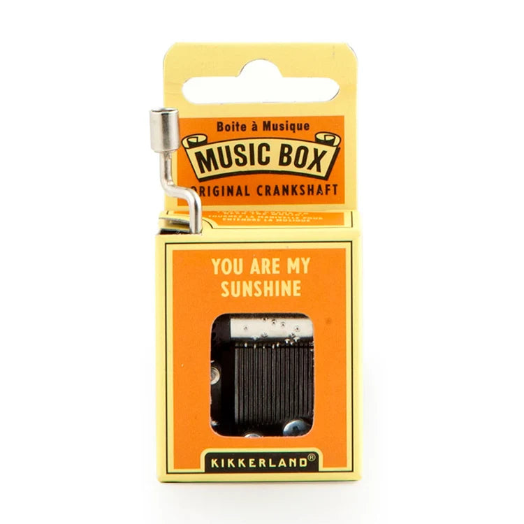 Yellow and orange 'You Are My Sunshine' crankshaft music box packaging with metal hand crank extended.