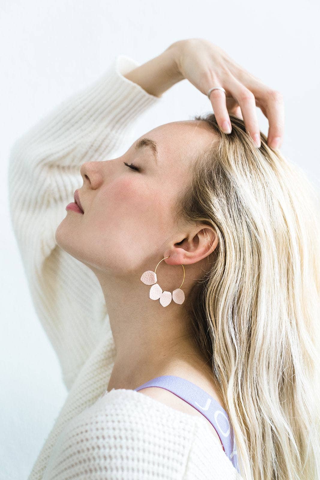 Blush pink leather petal hoop earrings on Whitebirch earring card