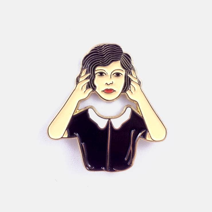 Enamel pin of an illustrated figure with hands pressed to their temples - PABOOM