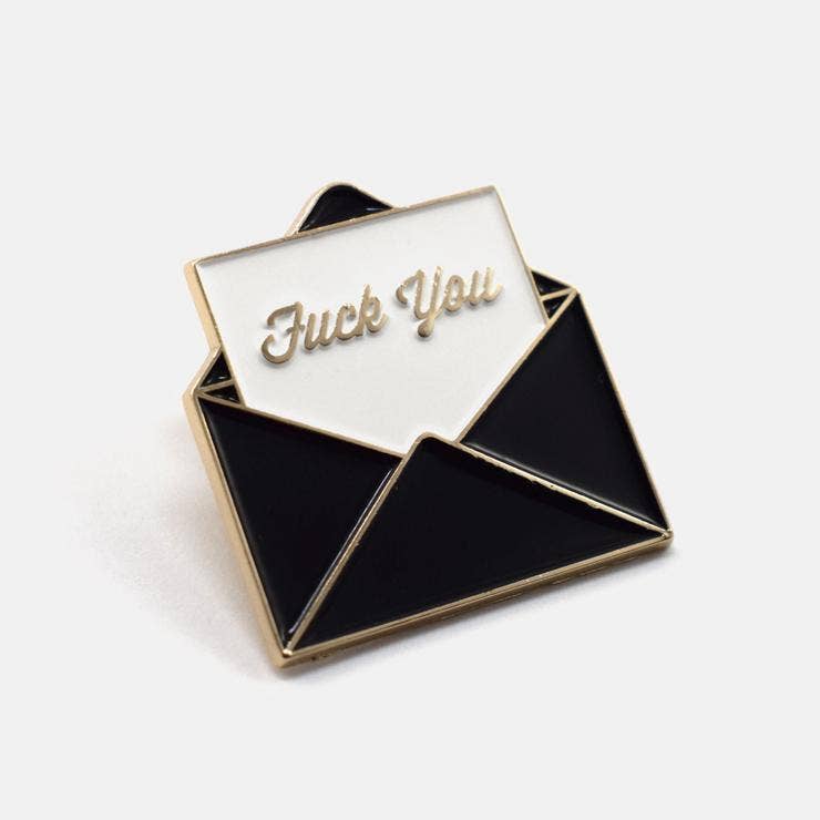 Black and gold enamel pin shaped like an envelope with a note reading Fuck You - PABOOM