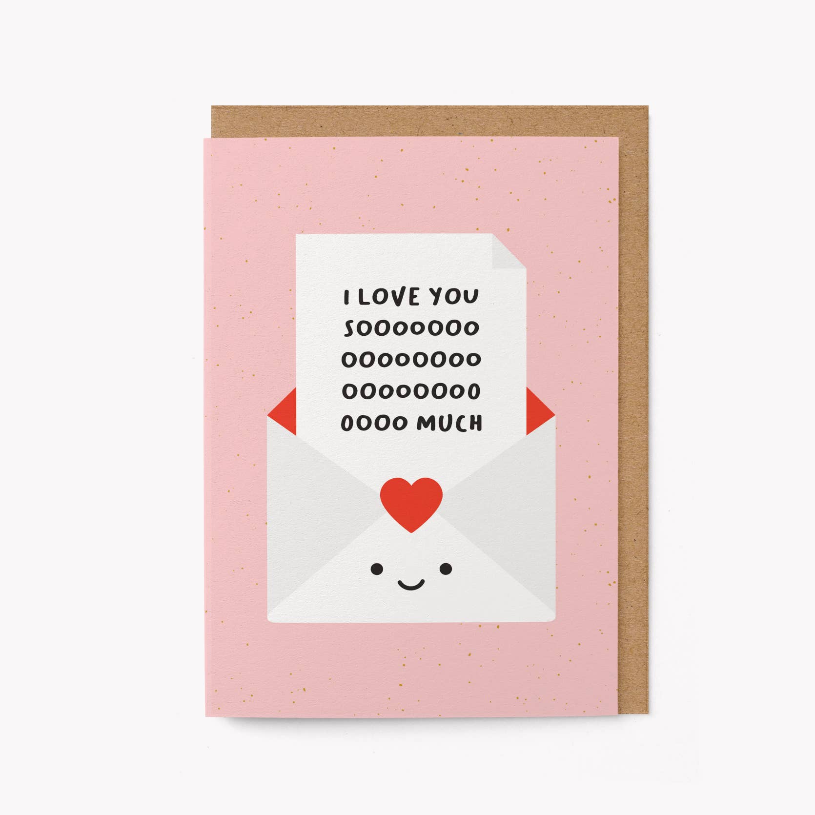 Pink greeting card with an illustrated smiling envelope holding a note that reads 'I love you soooo much,' kraft envelope alongside