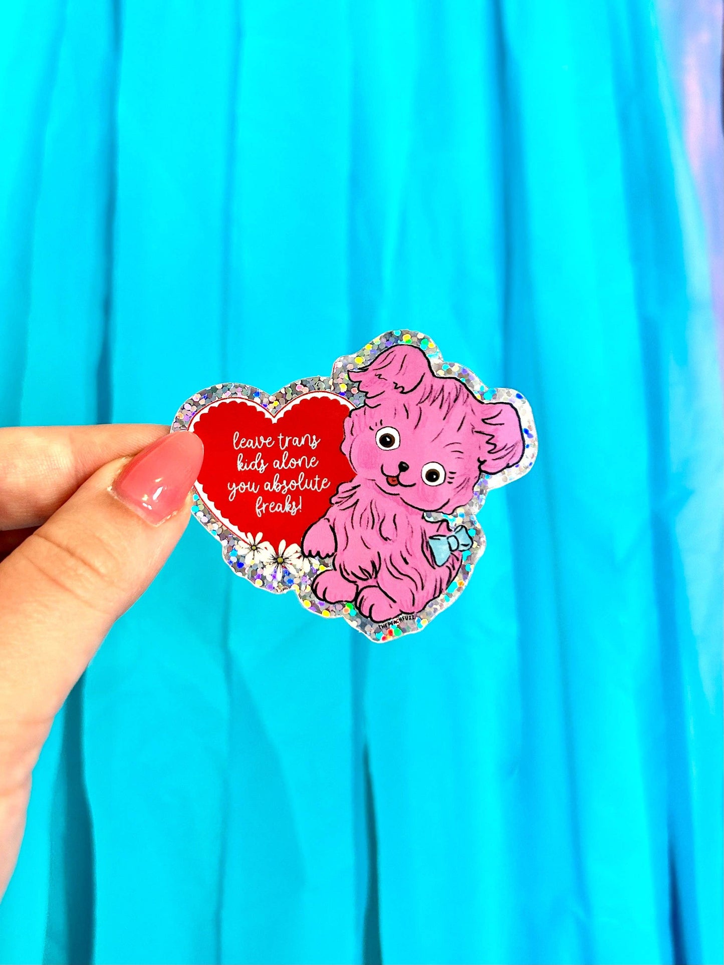 Leave Trans Kids Alone sticker styled with other The Peach Fuzz products