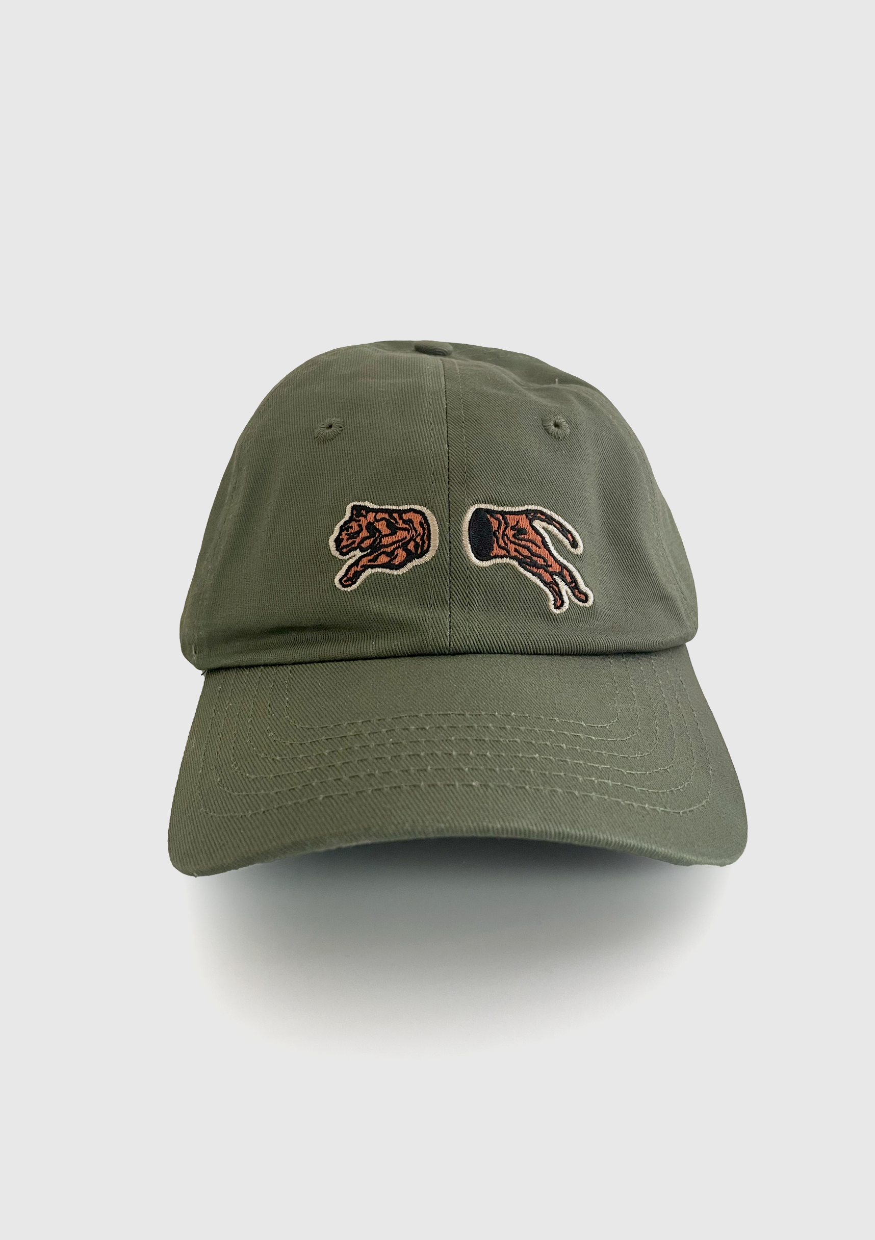 Sage green dad hat with a split embroidered tiger silhouette across the front - PABOOM