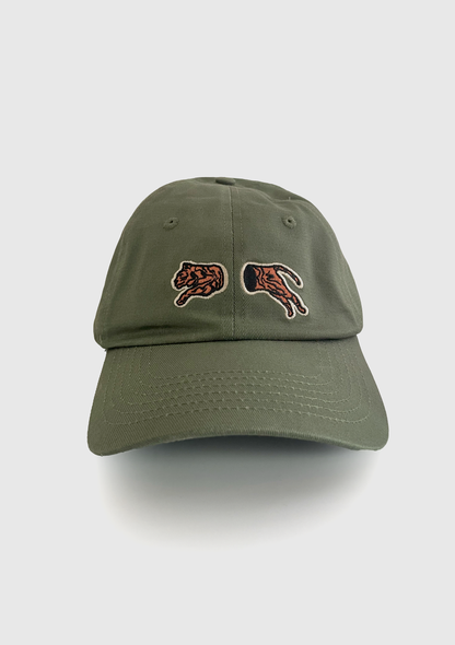 Sage green dad hat with a split embroidered tiger silhouette across the front - PABOOM