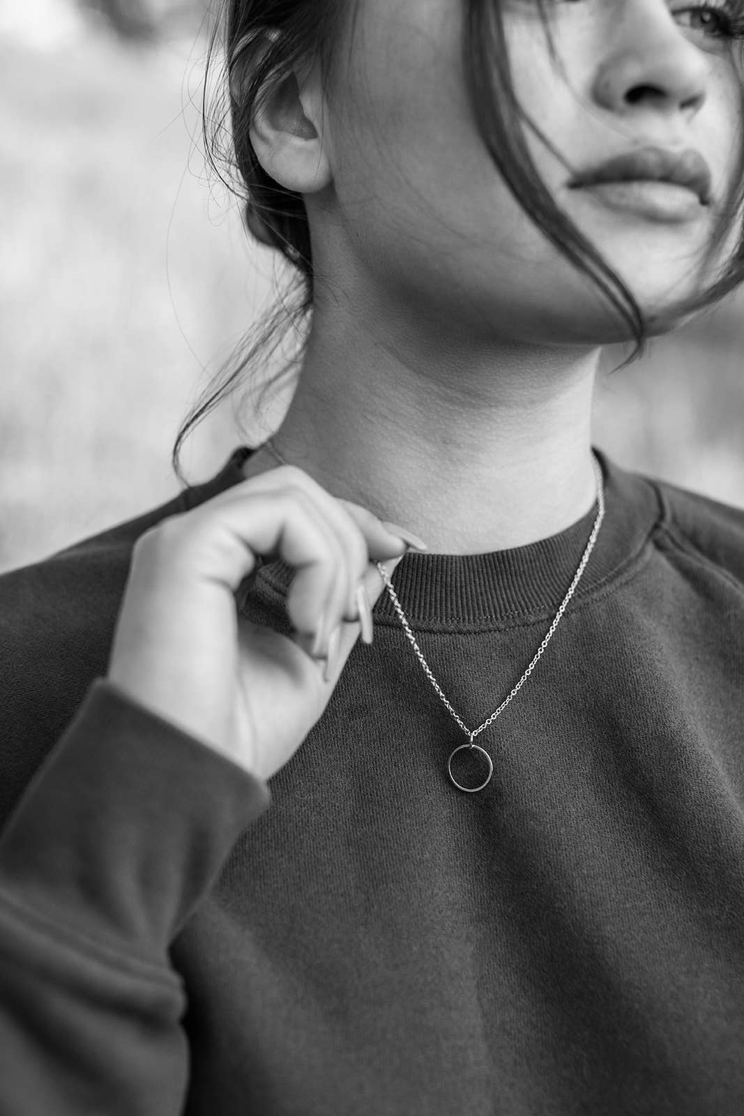 Brass circle pendant necklace shown at full chain length
