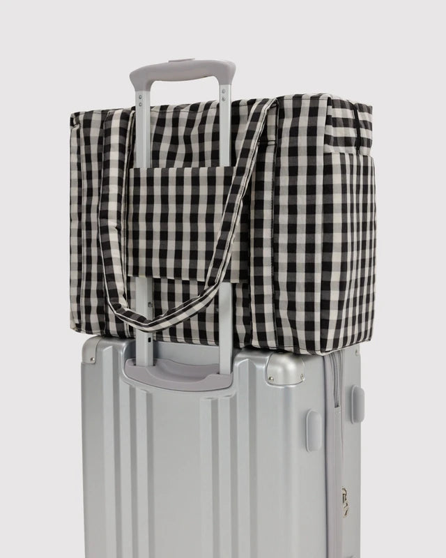 BAGGU Small Cloud Carry-On in black and cream gingham shown flat to highlight its exterior pockets